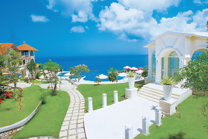 Wedding Chapel at Blue Point Bay Villas A white-painted building facing the ocean