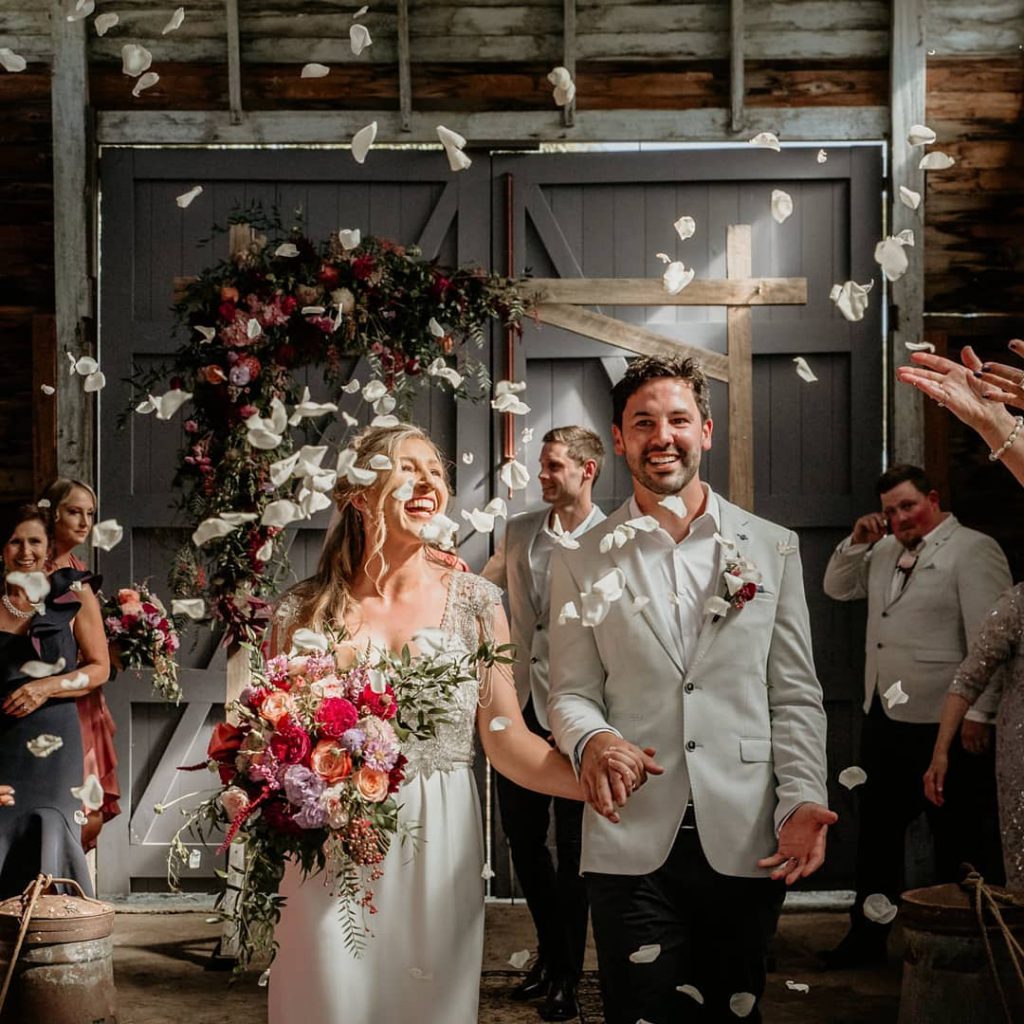 A flower shower in a barn wedding at Olinda Yarra