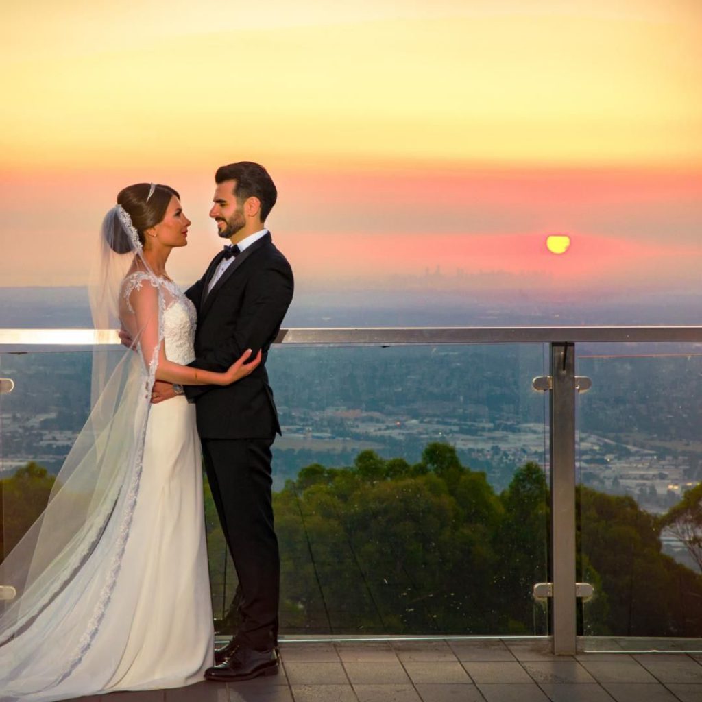 A wedding couple first look with skyline view as the backdrop