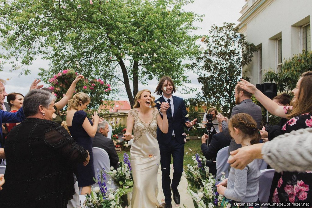 A couple walking amid flower shower