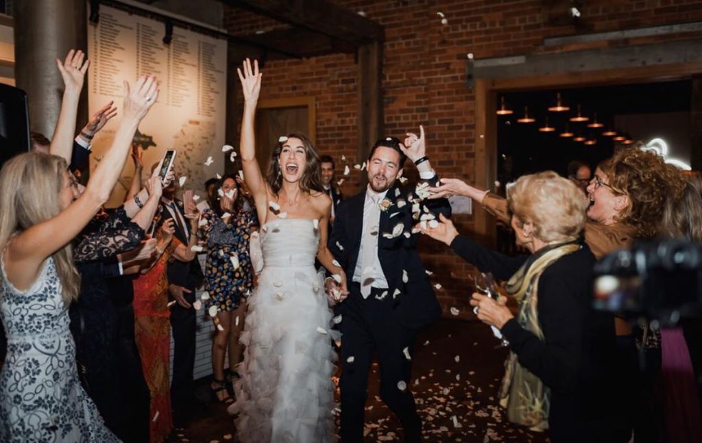 Couples during flower shower at The Epicurian Red Hill