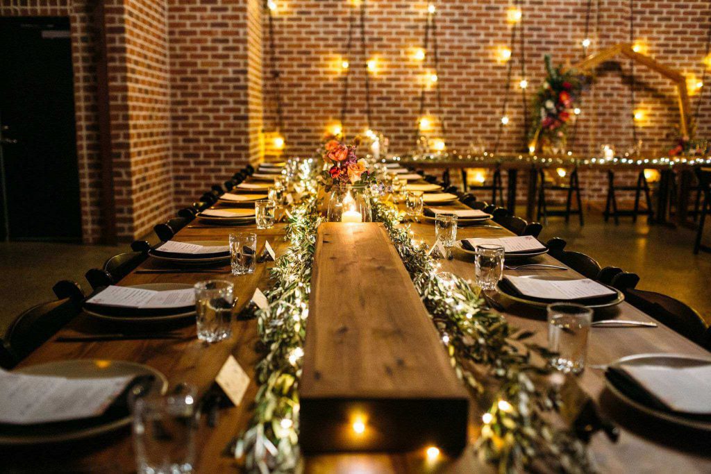 Rustic decoration with fairy lights at the brick wall of Factory 51