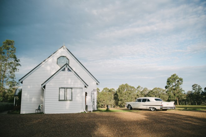 Lovedale wedding chapel with white vintage car 