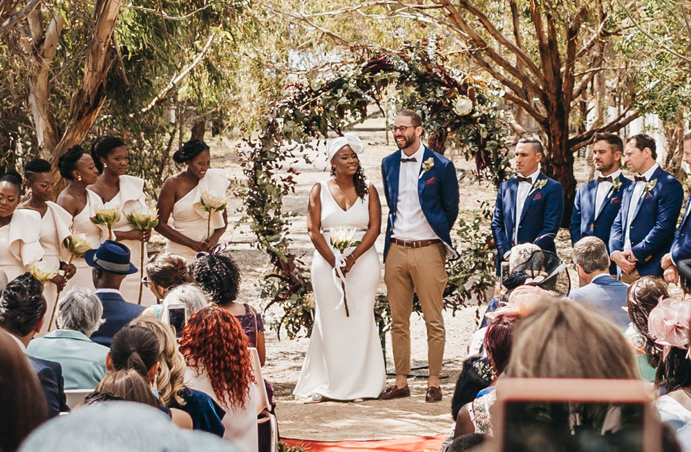 A couple get married under the natural shade of the Oneday winery