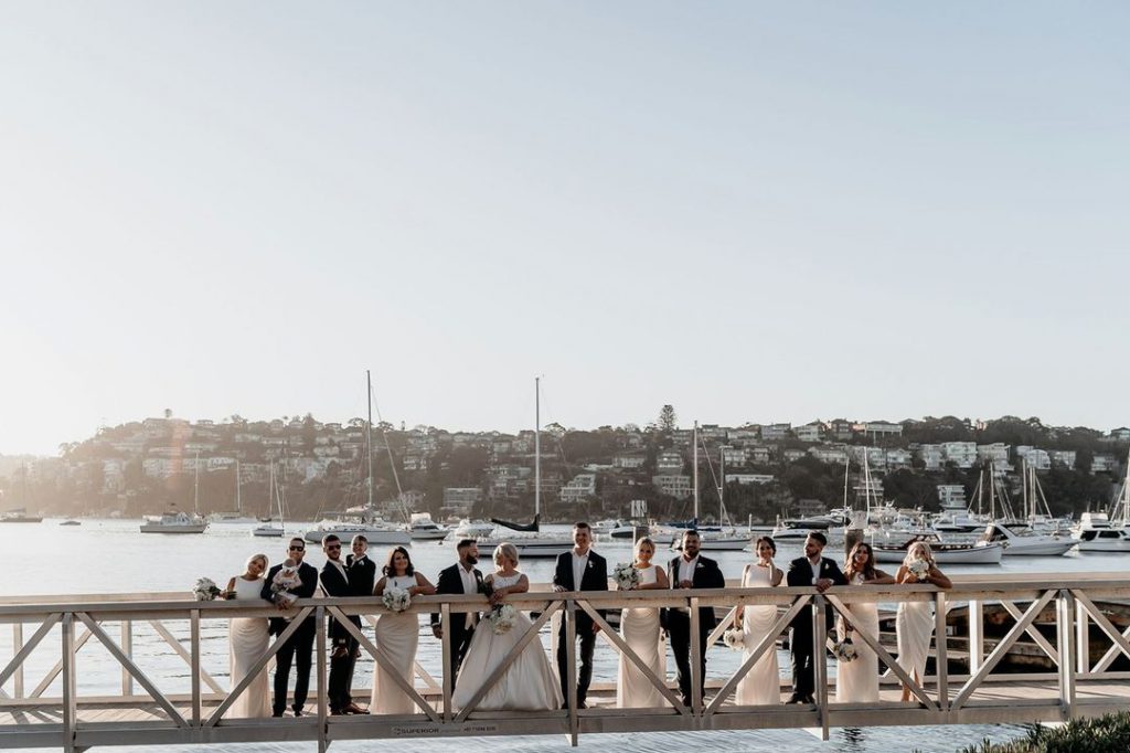 Couples, Groomsmen, Bridesmaids are standing on the jetty of Sydney Port