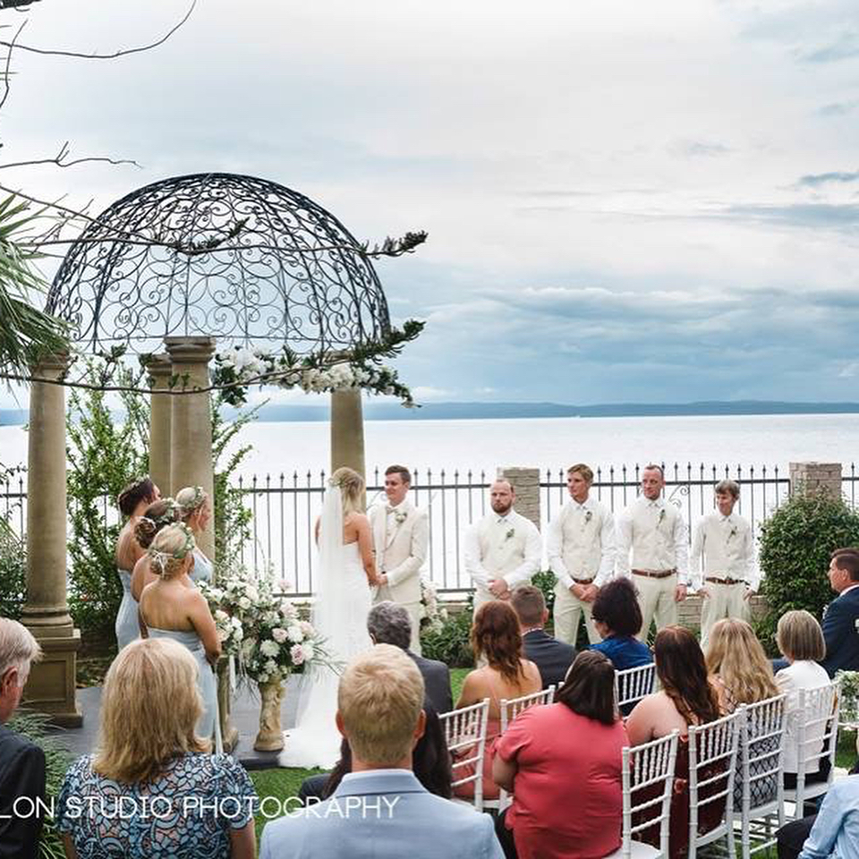 A wedding ceremony with ocean as the background