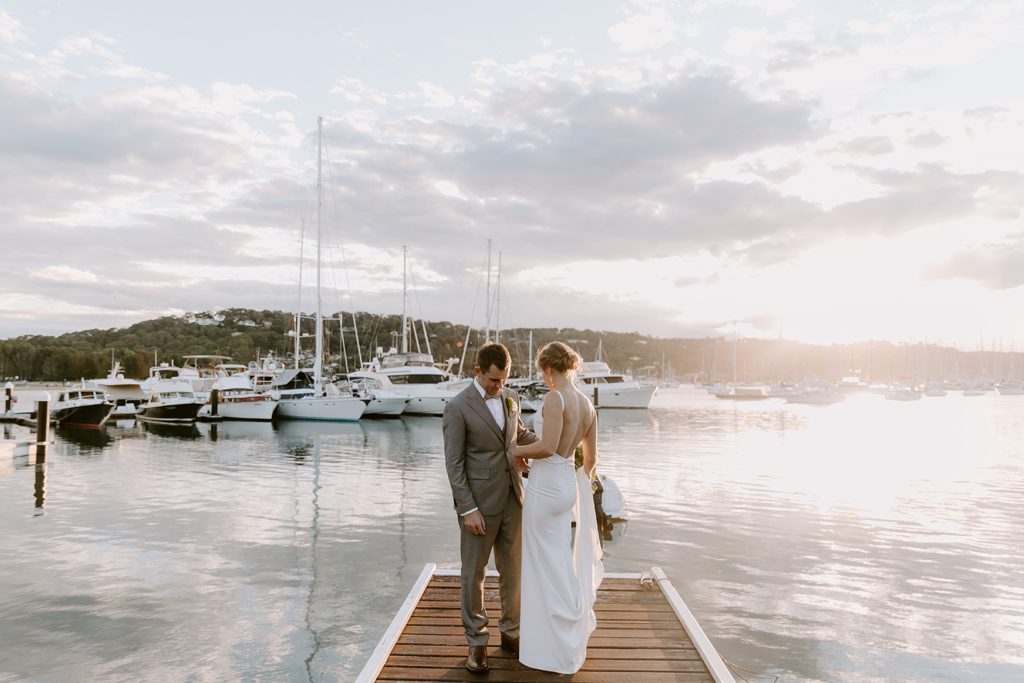 A couple is standing at a jetty