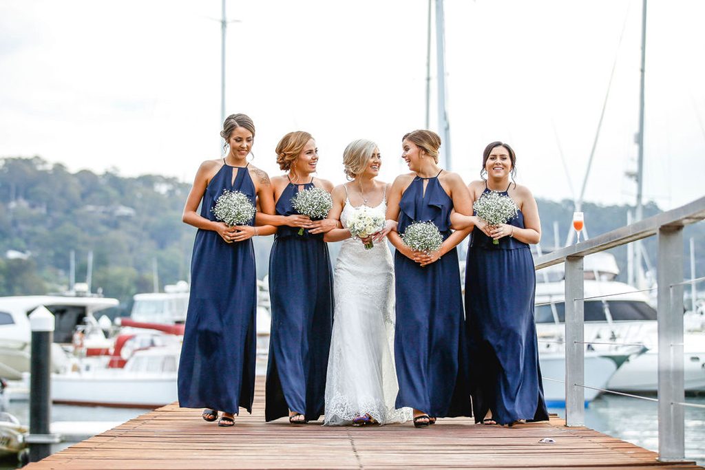 Bride and bridesmaids on the jetty